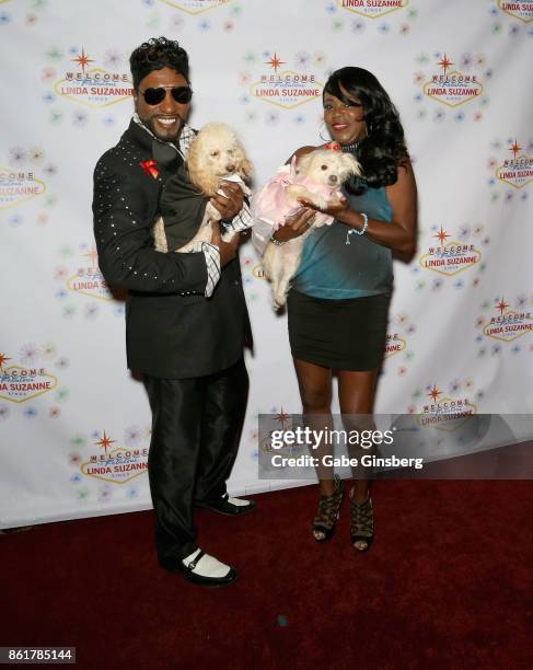 Entertainer Tyrone "T-Fox" Fox and his wife, Imani Fox pose with rescue dogs from Friends for Life Humane Society at the debut of "Linda Suzanne...