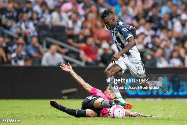 Aviles Hurtado of Monterrey fights for the ball with Edson Puch of Pachuca during the 13th round match between Monterrey and Pachuca as part of the...