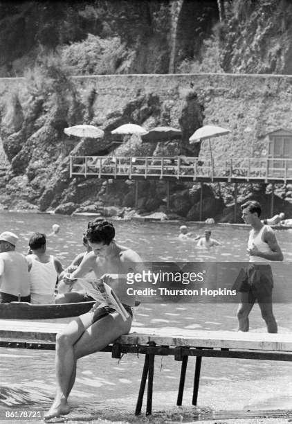 Holidaymakers on Paraggi Beach near the tourist resort of Portofino, Italy, August 1952. Original Publication : Picture Post - 6023 - unpub