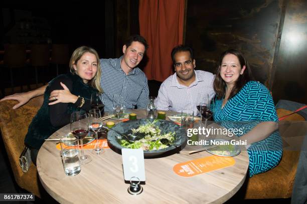 Guests attend a dinner with Masa Takayama as part of the Bank of America Dinner Series presented by The Wall Street Journal during Food Network &...