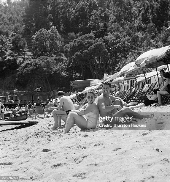 Holidaymakers on Paraggi Beach near the tourist resort of Portofino, Italy, August 1952. Original Publication : Picture Post - 6023 - unpub