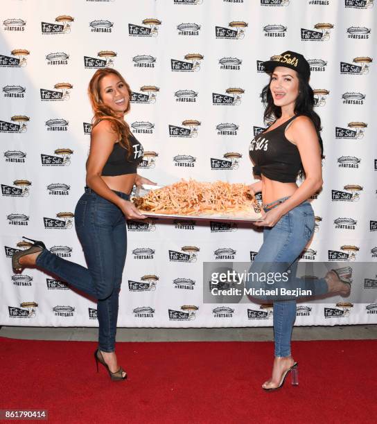 Kathryn Le and CJ Sparxx attends Fat Sal's Encino Grand Opening Party on October 15, 2017 in Encino, California.