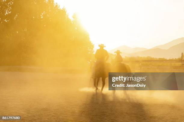 father son horseback riding in the utah country with early morning light - prairie silhouette stock pictures, royalty-free photos & images