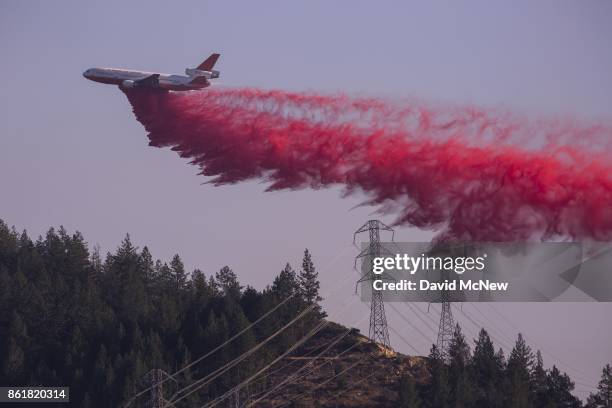 Air tanker drops fire retardant at the Oakmont Fire on October 15, 2017 near Santa Rosa, California. At least 40 people were killed with many are...