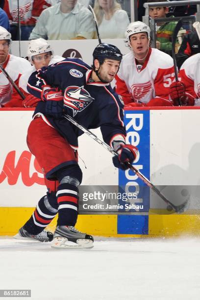 Defenseman Fedor Tyutin of the Columbus Blue Jackets shoots the puck against the Detroit Red Wings during Game Three of the Western Conference...
