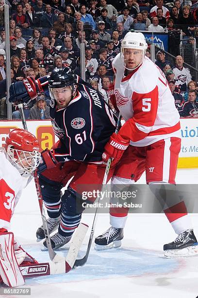 Defenseman Nicklas Lidstrom of the Detroit Red Wings defends against forward Rick Nash of the Columbus Blue Jackets during Game Three of the Western...