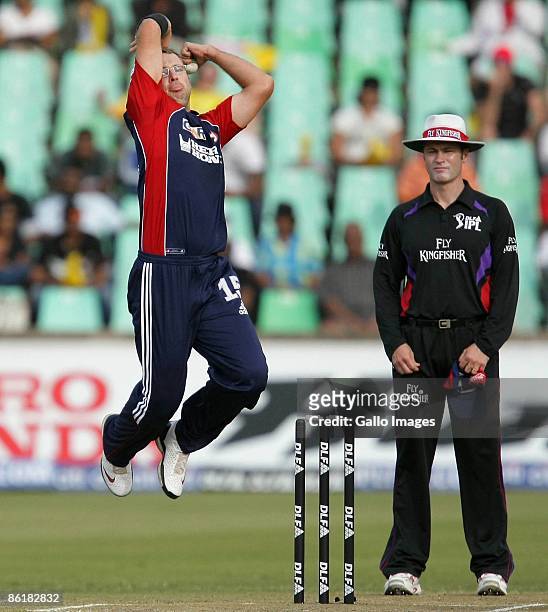Daniel Vettori bowls while Umpire Simon Taufel looks on during the IPL T20 match between Chennai Super Kings and Delhi Daredevils from Sahara Park on...