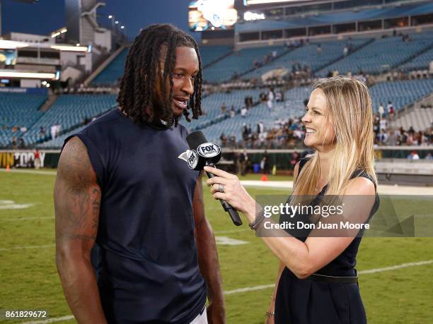 Runningback Todd Gurley II of the Los Angeles Rams talk with Fox Sideline Reporter Shannon Spake after the game against the Jacksonville Jaguars at...