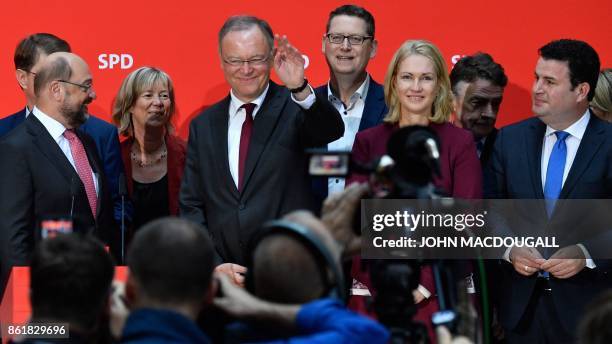 Lower Saxony's State Premier Stephan Weil , winner of regional elections in his northwestern federal state, waves during a meeting at the...