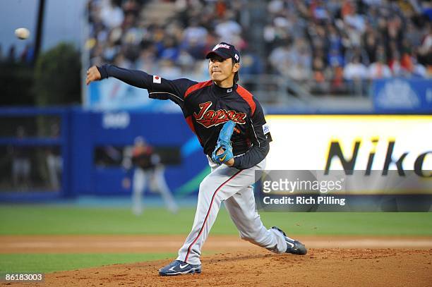 Hisashi Iwakuma of Japan pitches against Korea during the World Baseball Classic final game at Dodger Stadium in Los Angeles, California on March 23,...