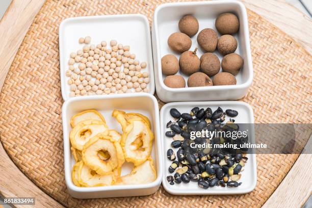 nuts and seeds, neatly organised - longan stock pictures, royalty-free photos & images