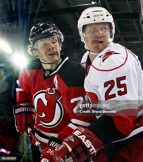 Patrik Elias of the New Jersey Devils and Joni Pitkanen of the Carolina Hurricanes battle during Game Two of the Eastern Conference Quarterfinal...