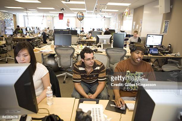 Employees at work in the Facebook headquarters, where the atmosphere is casual and laid-back, in Palo Alto, March 31, 2009. Founded in 2004, Facebook...