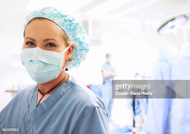 nurse circulator in operating room, portrait       - hospital mask stock pictures, royalty-free photos & images