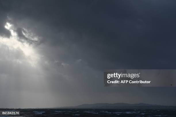 Dark clouds gather over the Irish Sea and Dublin on October 16, 2017 as Ireland braces for the passing of the storm Ophelia. Schools were closed on...