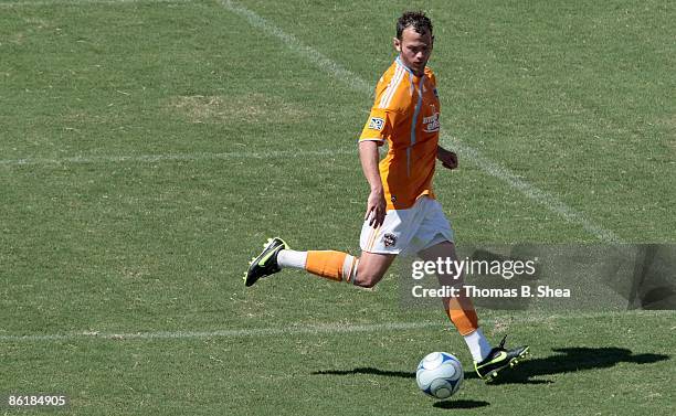 Brad Davis of the Houston Dynamo dribbles the ball against the Colorado Rapids at Robertson Stadium on April 19, 2009 in Houston, Texas.