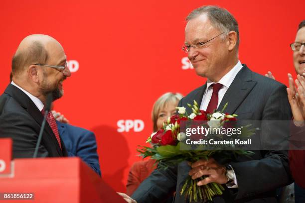 Martin Schulz , head of the German Social Democrats , congrats Stephan Weil, incumbent SPD candidate in yesterday's state elections in Lower Saxony,...