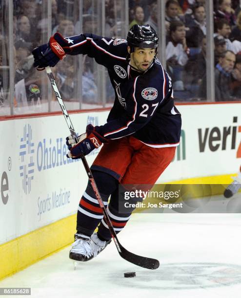 Manny Malhotra of the Columbus Blue Jackets controls the puck against the Detroit Red Wings during Game Three of the Western Conference Quarterfinals...