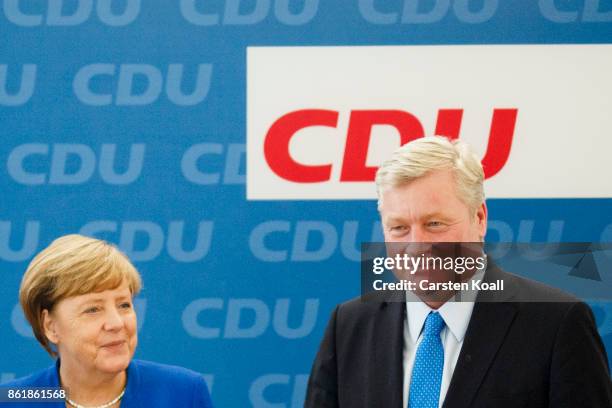 German Chancellor and leader of the German Christian Democrats Angela Merkel applauds CDU lead candidate in yesterday's state elections in Lower...