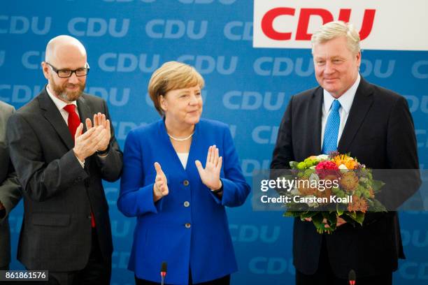 Secretary general Peter Tauber , German Chancellor and leader of the German Christian Democrats Angela Merkel and CDU lead candidate in yesterday's...