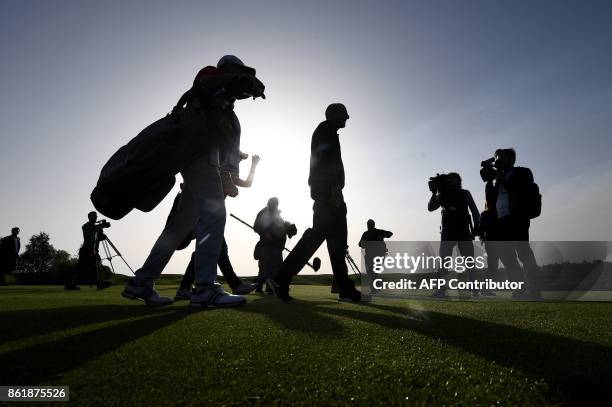 S Ryder Cup captain, Jim Furyk walks on a green during the 2018 Ryder Cup media day on october 16, 2017 at the Golf National in Guyancourt, near...