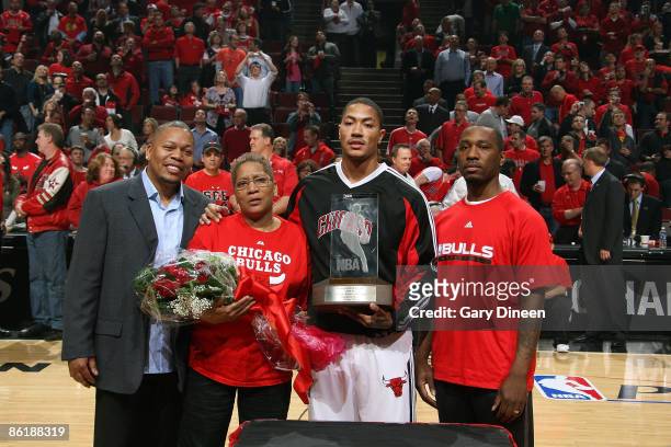 Mobile Rookie of the Year Derrick Rose of the Chicago Bulls poses with his family and the Eddie Gottlieb trophy prior to the game against the Boston...