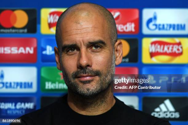 Manchester City's Spanish manager Pep Guardiola attends a press conference in Manchester, north west England on October 16 on the eve of their UEFA...