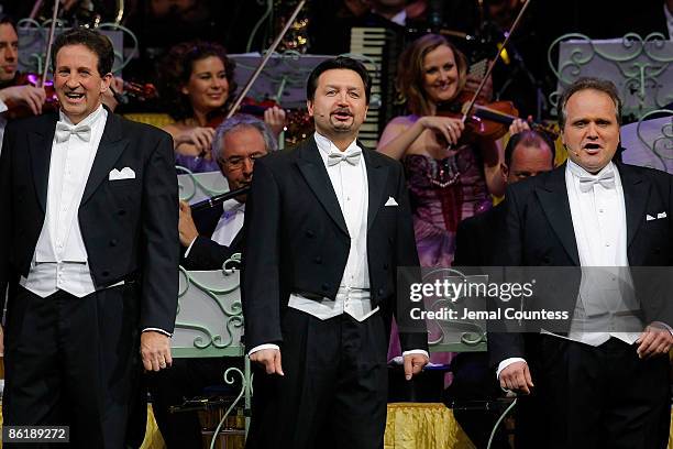 Gary Bennett, Bela Mavrak and Thomas Gruel of the Platin Tenors perform with violinist Andre Rieu and his orchestra perform at Hammerstein Ballroom...