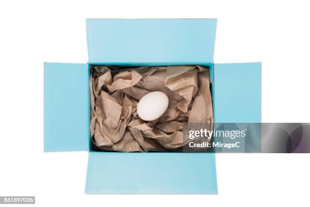 egg safely packed in a box - fragile sign stock pictures, royalty-free photos & images