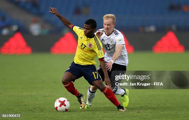 Deiber Caicedo of Colombia battles with Dennis Jastrzembski of Germany during the FIFA U-17 World Cup India 2017 Round of 16 match between Colombia...