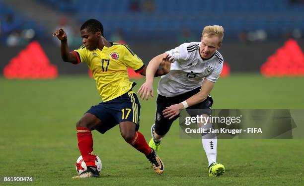 Deiber Caicedo of Colombia battles with Dennis Jastrzembski of Germany during the FIFA U-17 World Cup India 2017 Round of 16 match between Colombia...