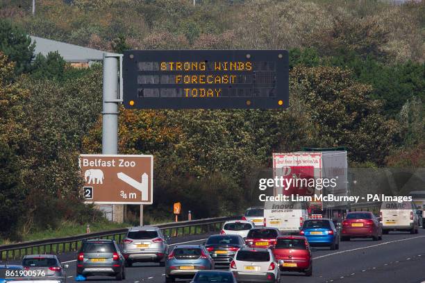 An overhead road sign on Belfast's M2 motorway warning drivers of, "Strong Winds Forecast Today", as Hurricane Ophelia hits the UK and...