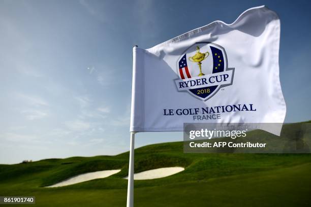 The Ryder Cup's flag is seen during the 2018 Ryder Cup media day on october 16, 2017 at the Golf National in Guyancourt, near Paris, the venue of the...