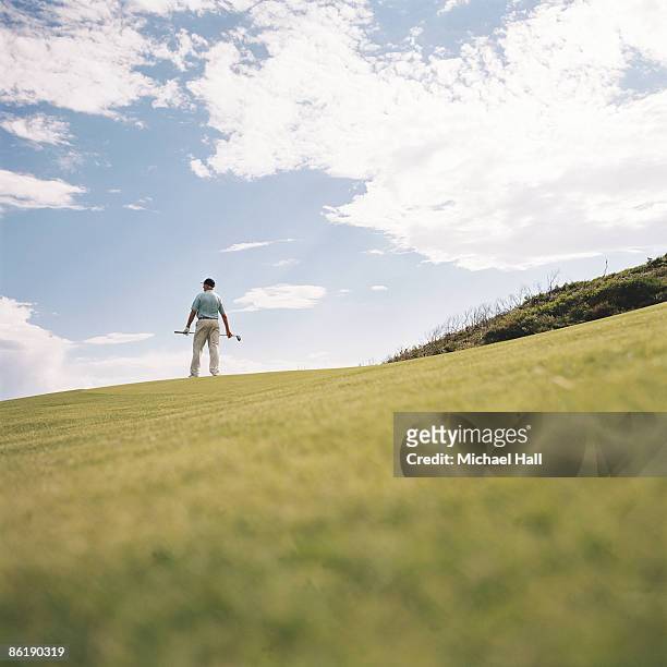 man with golf club - golf australia foto e immagini stock