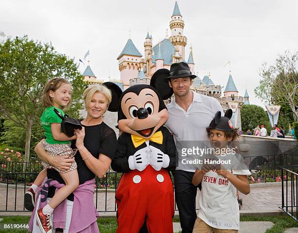 In this handout photo provided by Disneyland, Actor Hugh Jackman, his wife Deborra Lee Furness, and children Oscar Jackman and Ava Jackman pose with...