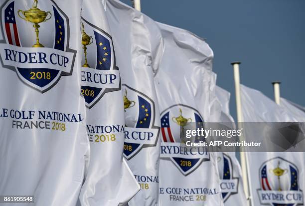 Ryder Cup's flags are seen during the 2018 Ryder Cup media day on october 16, 2017 at the Golf National in Guyancourt, near Paris, the venue of the...