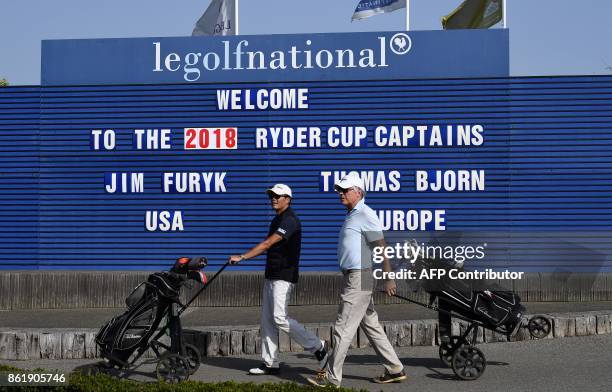 Players walk during the 2018 Ryder Cup media day on october 16, 2017 at the Golf National in Guyancourt, near Paris, the venue of the event, to be...