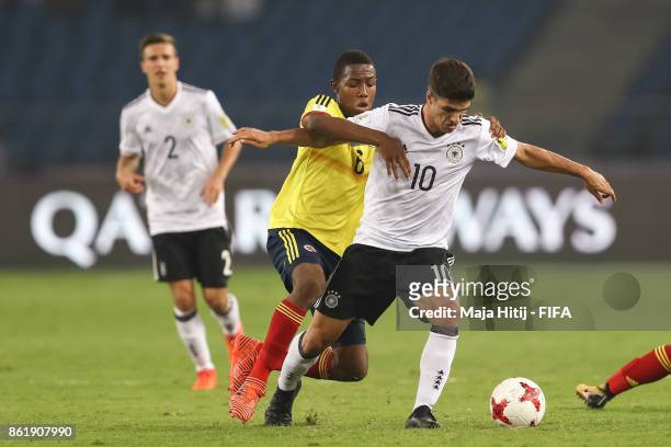 Andres Perea of Colombia and Elias Abouchabaka of Germany battle for the ball during the FIFA U-17 World Cup India 2017 Round of 16 match between...