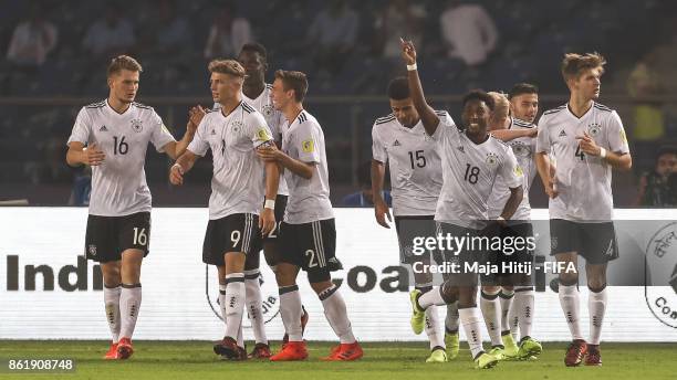 John Yeboah celebrates with his team-mates after scoring a goal to make it 0-3 during the FIFA U-17 World Cup India 2017 Round of 16 match between...