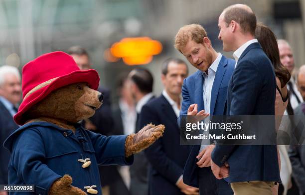 Prince William, Duke of Cambridge and Catherine, Duchess of Cambridge with Prince Harry are joined by Paddington Bear at the Charities Forum Event on...