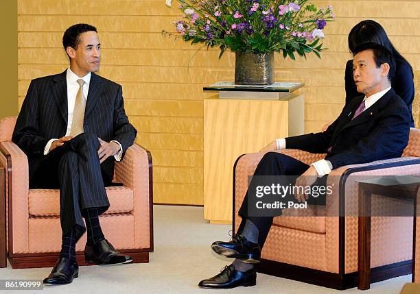 Charles Phillips , President of Oracle Corporation, chats with Japanese Prime Minister Taro Aso as he pays a courtesy call on the leader at his...