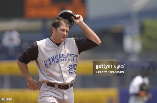 First baseman Mike Sweeney of the Kansas City Royals takes off his batting helmet during the MLB game against the New York Mets on June 23, 2002 at...