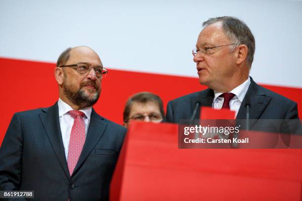 Martin Schulz , head of the German Social Democrats , looks to Stephan Weil , incumbent SPD candidate in yesterday's state elections in Lower Saxony,...