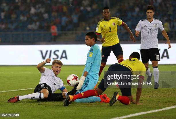 Jann-Fiete Arp of Germany has his shot at goal blocked by Kevin Mier of Colombia during the FIFA U-17 World Cup India 2017 Round of 16 match between...