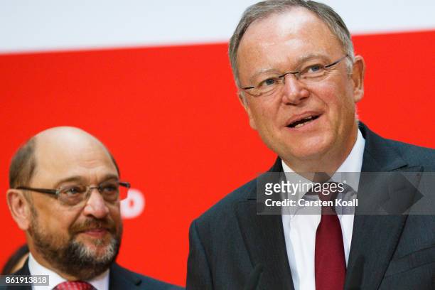 Martin Schulz , head of the German Social Democrats , looks to Stephan Weil , incumbent SPD candidate in yesterday's state elections in Lower Saxony,...