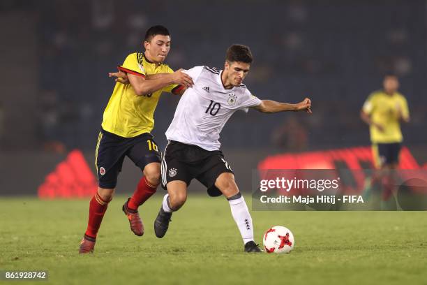 Fabian Angel of Colombia and Elias Abouchabaka of Germany battle for the ball during the FIFA U-17 World Cup India 2017 Round of 16 match between...