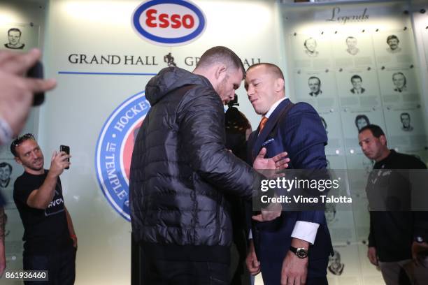 Middleweight champion Michael Bisping goes nose to nose with Canadian Georges St-Pierre in Friday's UFC 217 teaser at the Hockey Hall of Fame.