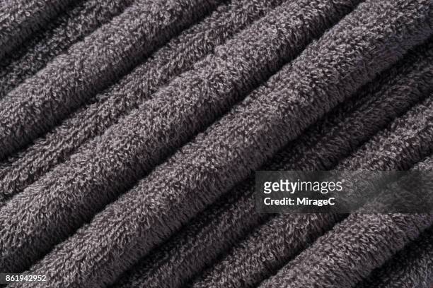 stacking of folded towel texture - frottee stock-fotos und bilder