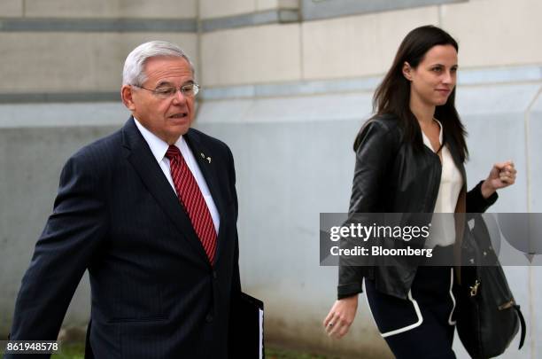 Senator Robert Menendez, a Democrat from New Jersey, left, arrives at federal court in Newark, New Jersey, U.S., Monday, Oct. 16 2017. Menendez is...