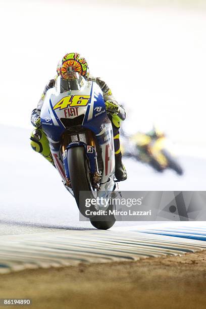 Valentino Rossi of Italy and Fiat Yamaha Team lifts the front wheel during the MotoGP of Japan practice day at Twin Ring Motegi on April 24, 2009 in...